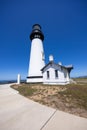 Yaquina Head Lighthouse against blue sky, along Pacific coast in Oregon, USA Royalty Free Stock Photo