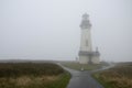 Yaquina Head Lighthouse in the fog. Oregon United States of America. Royalty Free Stock Photo