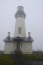 Yaquina Head Lighthouse in the fog. Oregon United States of America. Royalty Free Stock Photo