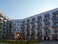 Yard area of a modern European residential complex, multi storey residential buildings with a playground and benches. Royalty Free Stock Photo