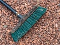 Yard brush closeup of broom head on gravel path