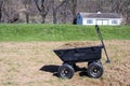 Yard cart full with grasses and dirt