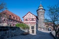 Yard of Castle of Nuremberg with half-timbered houses and tower in Nuremberg, Germany. Historic old town.