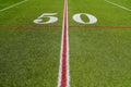 On the 50 yard line of a football field Royalty Free Stock Photo