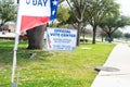 Yard sign and vote banner flag show Official Vote Center in English, Spanish, Vietnamese to welcome resident and non-English-