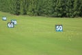 Yard signs in driving range Royalty Free Stock Photo