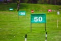 Yard signs in driving range Royalty Free Stock Photo