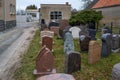 in a yard of a stonemason\'s workshop there are many different gravestones next to each other Royalty Free Stock Photo