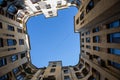 The yard is a well in St. Petersburg. Bottom view. Stone walls going up. The central part of St. Petersburg. Windows, downpipes,