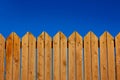 Yard wooden fence palisade garden object vivid blue sky background and empty copy space for your text