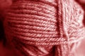 Yarn ball close-up with blur effect in red tone Royalty Free Stock Photo