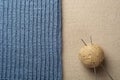 Yarn Ball, Knitting Needles And Part Of Knitted Wool Cloth Such As A Hat Or Scarf For The Autumn Or Winter Season.