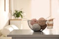 Yarn balls and knitting needles in metal basket on grey table indoors, space for text. Creative hobby Royalty Free Stock Photo