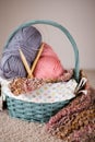 Yarn balls and round needles set in a basket Royalty Free Stock Photo