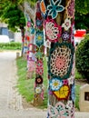 Yarn bombing in trees. European park. Royalty Free Stock Photo