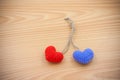 Yarn hearts on wood background Royalty Free Stock Photo