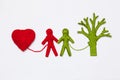 Yarn red heart, green tree and people figures isolated on white.