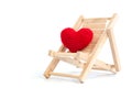 Yarn red heart on the wooden beach chair on white background isolated. copy space for text. Valentines day, love concept and lov