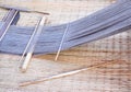 Yarn in weaving textile equipment on straw mat background Royalty Free Stock Photo