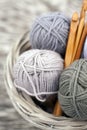 Yarns in basket with crochet hooks in harmonious colors. knitting, crocheting supplies.