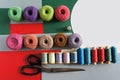 Yarns of threads for knitting in different colors on a red green Royalty Free Stock Photo