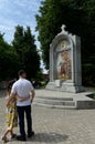 Tourists at the monument `Oath of Prince Pozharsky` in the Yaroslavl state historical,architectural and art Museum-reserve
