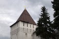 Yaroslavl Russia, workman re-roofing a tower in the kremlin wall on a stormy day