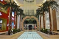 Yas Mall entrance, Flower love arch, hanging flowers, indoor palm rows