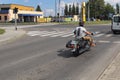Yaslo, Poland - july 12 2018:The biker rides a stylish chopper on an asphalt road. Cruise on an iron horse. The life style of the