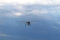 Yaslo, Poland - july 1 2018: A light sport turboprop aircraft flies across the sky among the rainy clouds. Landing in difficult we