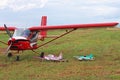 Yaslo, Poland - july 3 2018: Models of airplanes on the airfield stand near the light two-seater turboprop aircraft of red color.