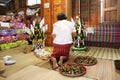 Thai people put food offerings of tradition of almsgiving with sticky rice and food to Buddhist alms bowl at Retro house on