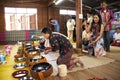 Thai people put food offerings of tradition of almsgiving with sticky rice and food to Buddhist alms bowl at Retro house on