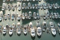 Yatch harbor marina pier and boat dock yatchs and vessels awaiting the open sea. Aerial drone view looking straight down above