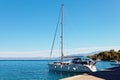 Yatch moored in the harbor near a small town - Croatia, island B