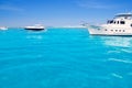 Yatch in turquoise beach of Formentera Royalty Free Stock Photo