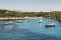 Yatchs in urquoise water in Cala Mondrago view from the sea, Mondrago Natural Park, Majorca