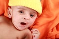 Yawning Baby with a Yellow Hat