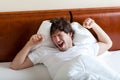 Yawning man after awakening Royalty Free Stock Photo