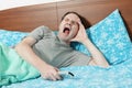 Yawning man in bed Royalty Free Stock Photo