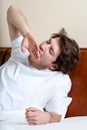 Yawning man in bed Royalty Free Stock Photo