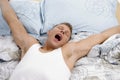 Yawning man stretching his arms Royalty Free Stock Photo