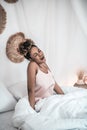 Yawning waking woman in morning in bed Royalty Free Stock Photo