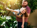 Yay I can fly. an adorable little girl having fun with her father in their backyard. Royalty Free Stock Photo