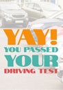 Yay, you passed your driving test text in orange, blue and red over parked cars Royalty Free Stock Photo