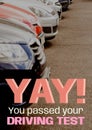 Yay, you passed your driving test text in white, pink and orange over parked cars Royalty Free Stock Photo