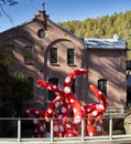 Yayoi Kusama Shine of life sculpture displayed in front of a building in Jevnaker, Norway