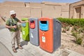 Traveler used recycling containers for glass, paper and plastic, Iran.