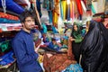 Young Iranian fabric seller in the bazaar of Yazd, Iran.