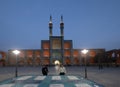 Muslim tourists at the Amir Chakhmaq Square with symmetrical sunken alcoves